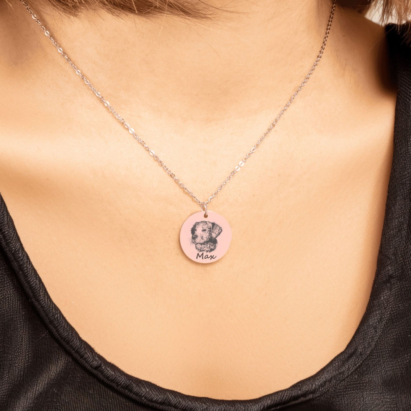 custom pet portrait necklace in rose gold worn by a woman in a black shirt
