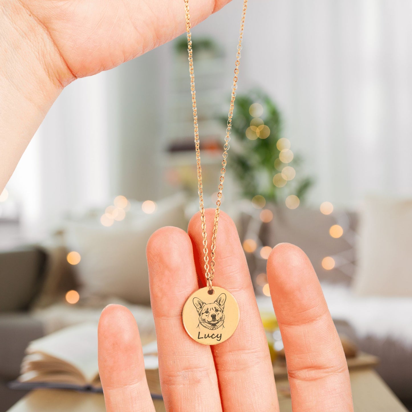 personalized pet portrait in gold held in hands