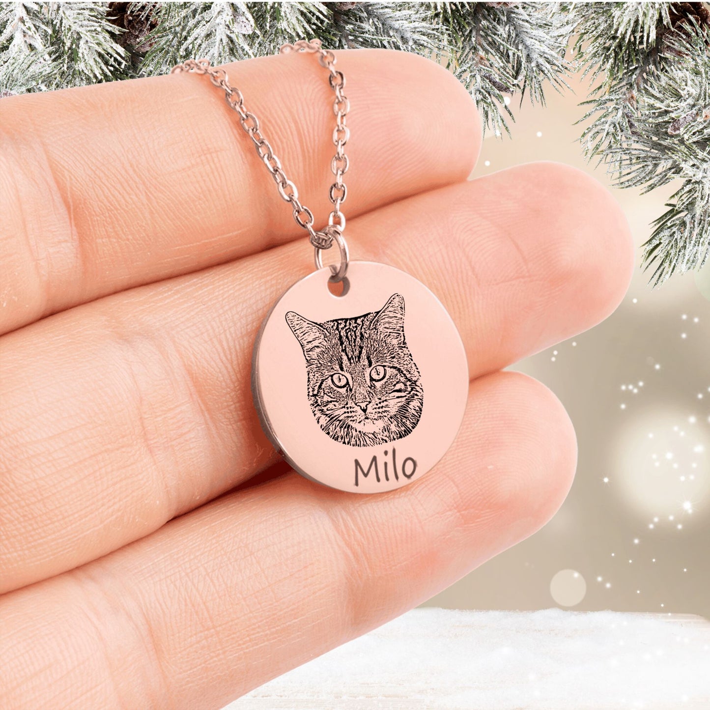 personalized cat picture necklace in rose gold held in a hand