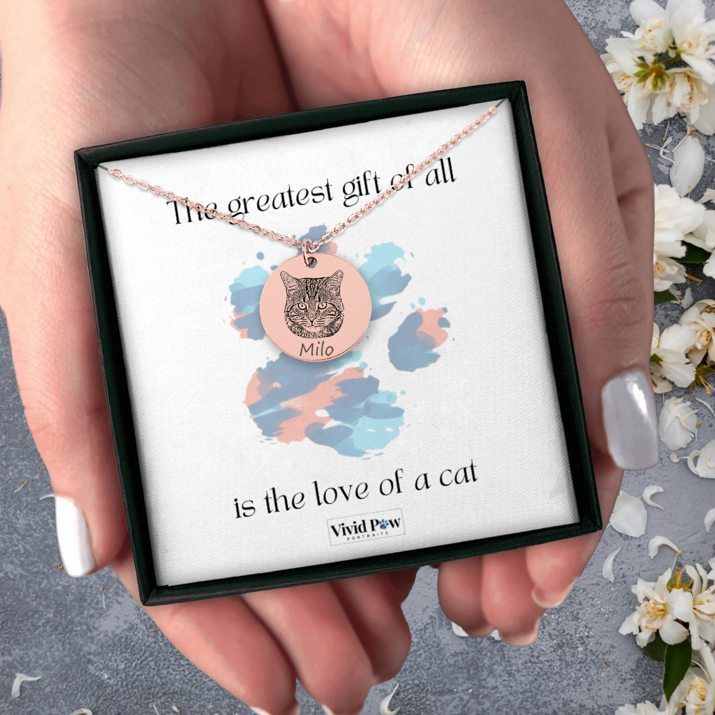 custom cat portrait necklace in rose gold held in hands