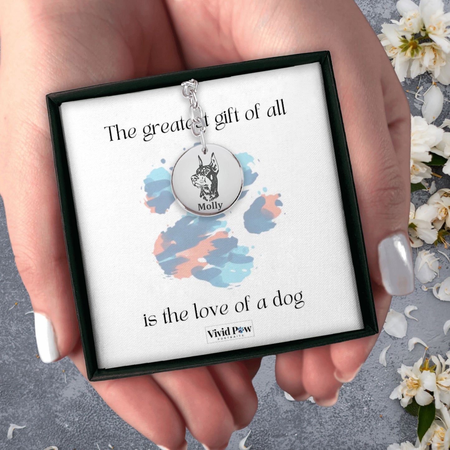 personalized dog picture keychain in silver held in hands