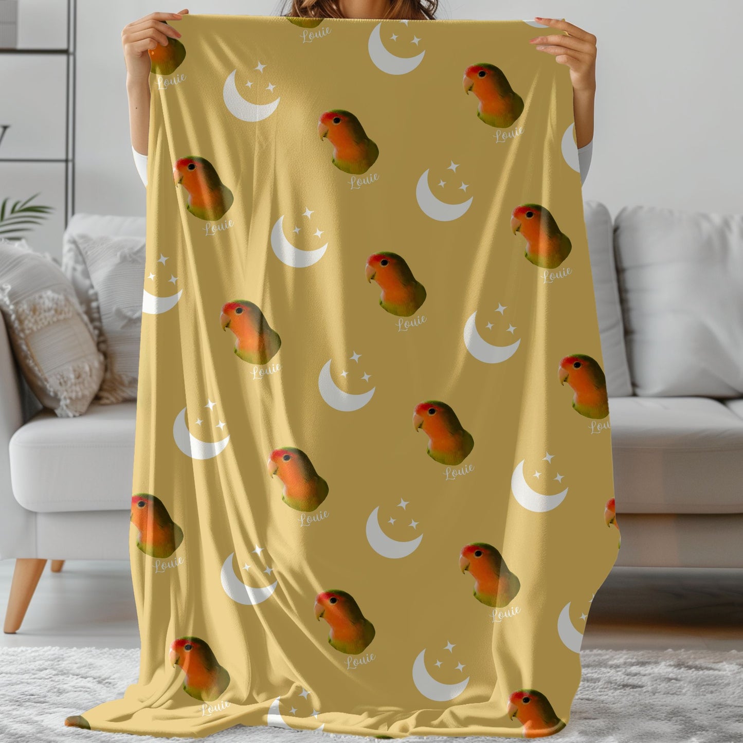 custom moon and stars pet photo blanket in soft gold with a lovebird on it held by a woman