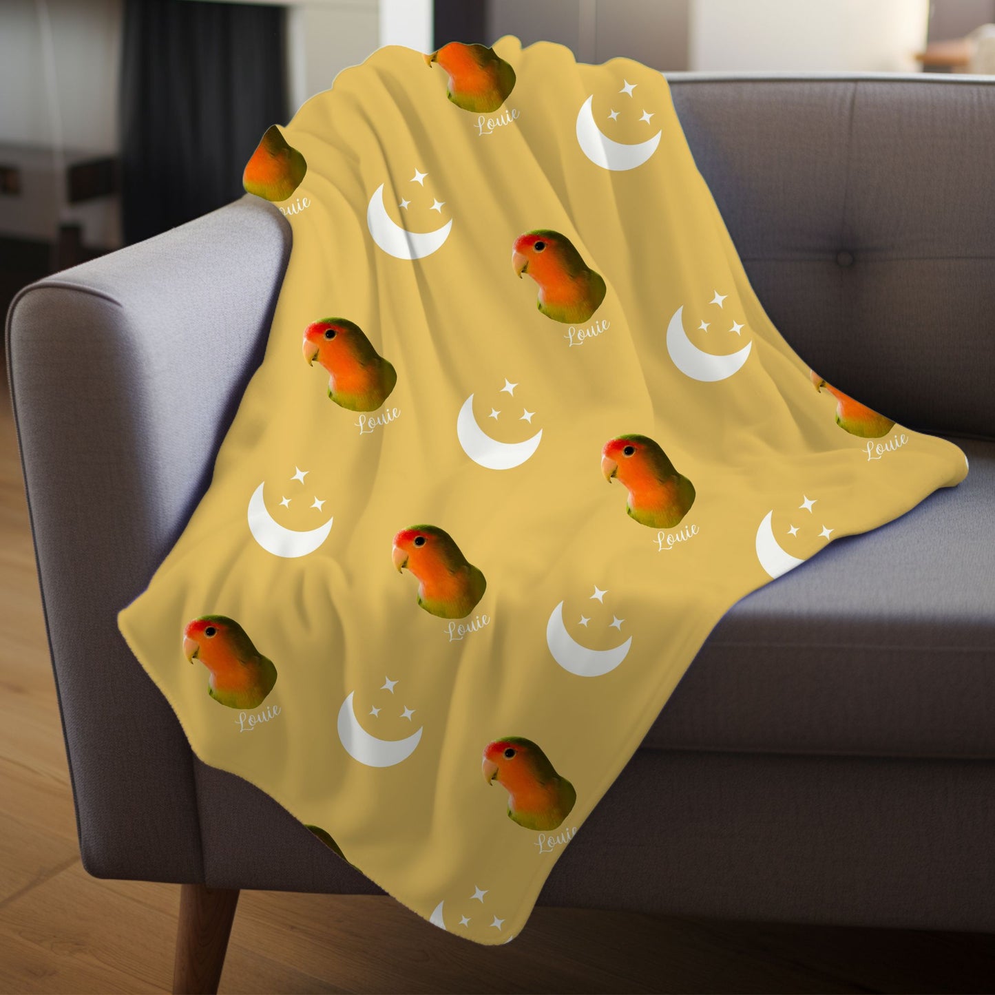custom pet photo moon and stars retro personalized blanket in soft gold with a bird on it draped over a sofa