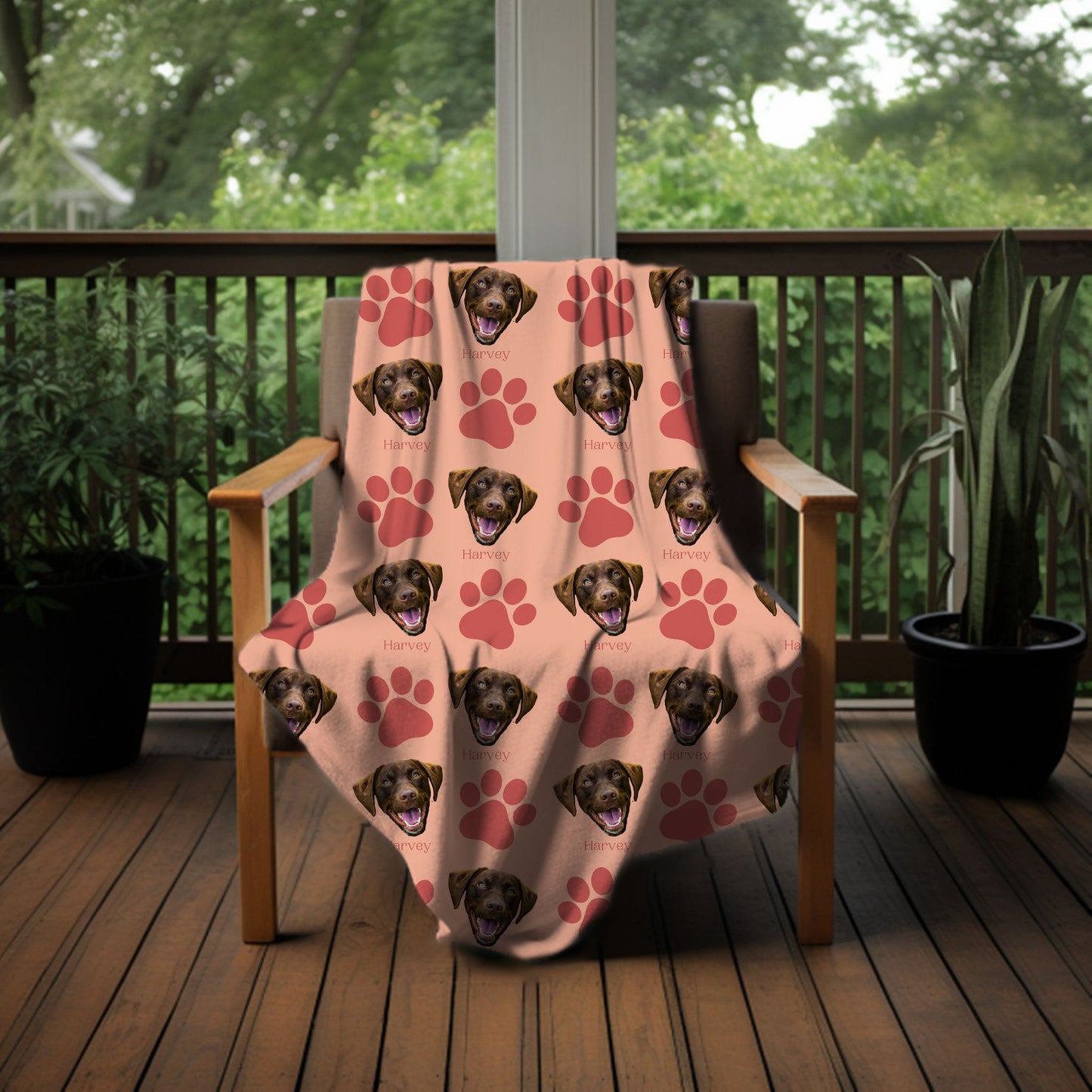 personalized dog face photo blanket in peachy/blush on a chair outside on a porch