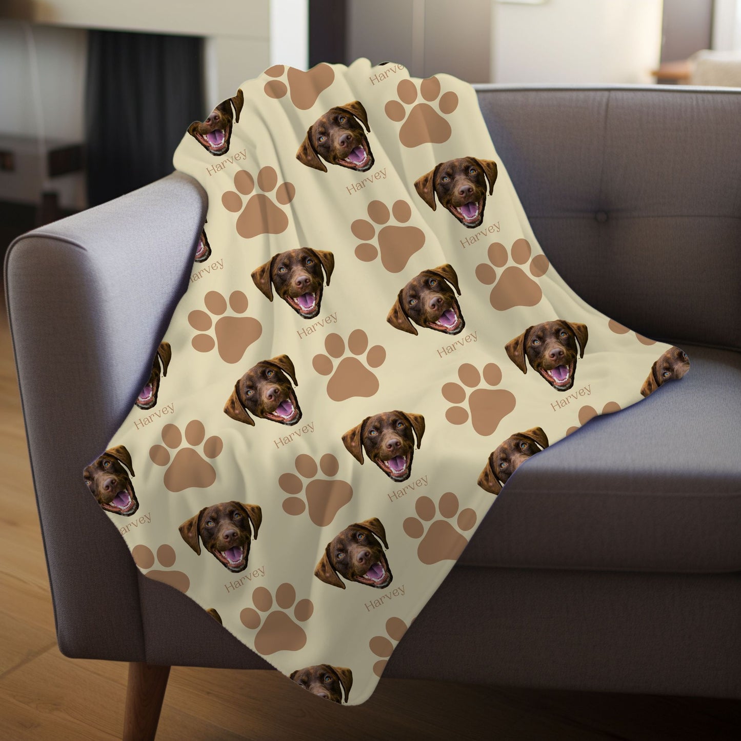 custom dog portrait and name blanket in sand/camel on a gray couch