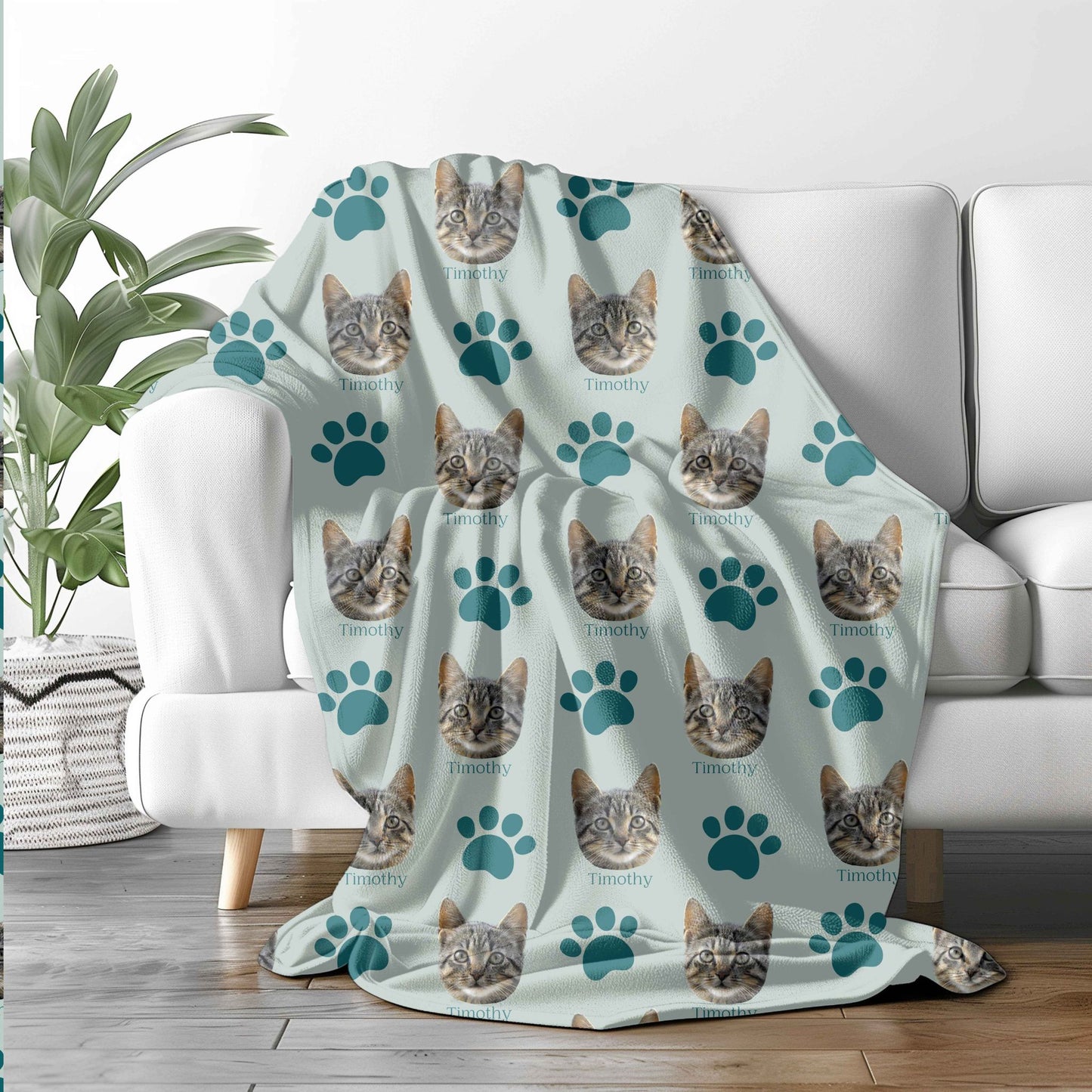 custom cat face portrait blanket in mint/ocean on a sofa