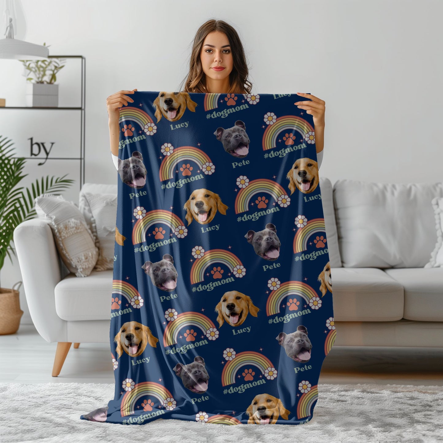 woman holding a custom dog mom pet photo blanket in navy