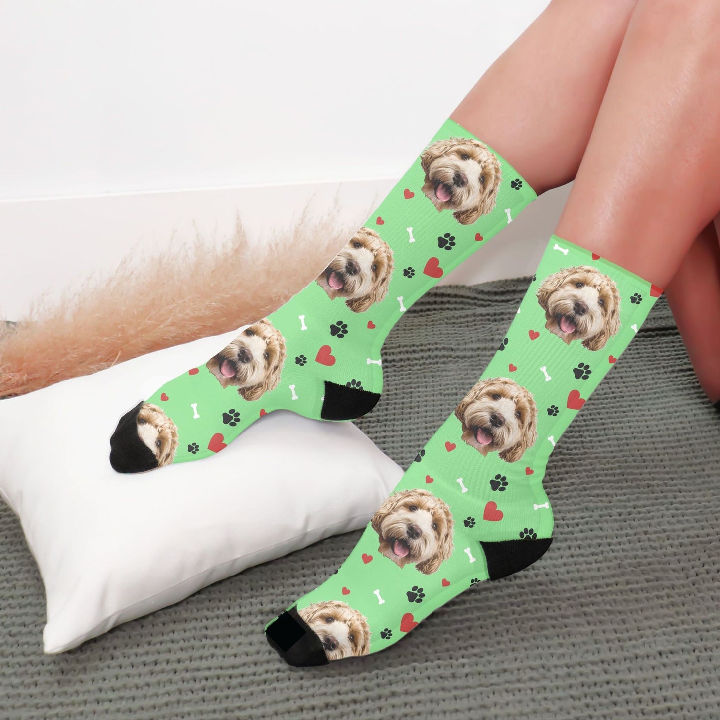 custom dog photo socks with paws and bones in green with a dog on them worn by a woman