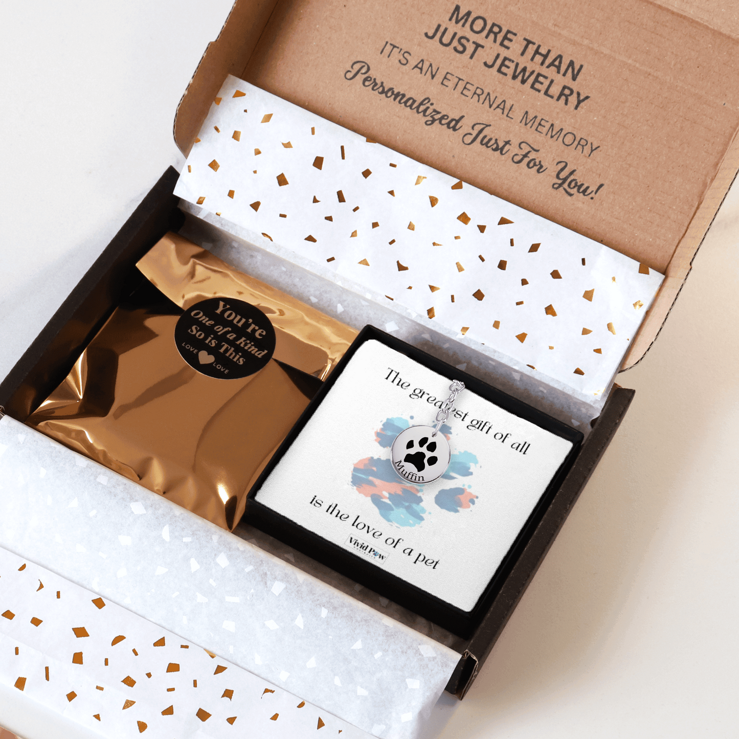 custom pet paw print keychain in silver packed in a beautiful gift box ready for gifting